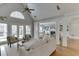 Sunlit living room showcasing hardwood floors and an open floor plan at 9120 Etching Overlook, Duluth, GA 30097