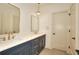 Elegant bathroom with dual vanity, marble counters, and gold fixtures at 1947 Clark Dr, Tucker, GA 30084