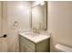 Modern bathroom with a green vanity and gold fixtures at 1947 Clark Dr, Tucker, GA 30084