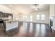 Open concept kitchen with island and dark cabinets at 2490 Melton Common Dr, Dacula, GA 30019