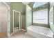 Main bathroom features garden tub, shower, and updated vanity at 447 Two Iron Nw Trl, Kennesaw, GA 30144