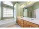 Main bathroom with double vanity and garden tub at 447 Two Iron Nw Trl, Kennesaw, GA 30144