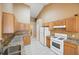 Kitchen with granite countertops and oak cabinets at 447 Two Iron Nw Trl, Kennesaw, GA 30144