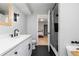 Updated bathroom boasting modern fixtures, black tile floor, and a shower/tub combo at 649 Ozburn Nw Rd, Atlanta, GA 30318
