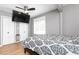 Bedroom features hardwood floors, and a modern ceiling fan at 649 Ozburn Nw Rd, Atlanta, GA 30318