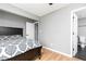 Spacious bedroom boasts wood floors and neutral tones at 649 Ozburn Nw Rd, Atlanta, GA 30318