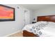 Bedroom with wood floors features closet and painting for added style at 649 Ozburn Nw Rd, Atlanta, GA 30318