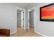 Bedroom features wood floor with view of closet with custom shelving at 649 Ozburn Nw Rd, Atlanta, GA 30318