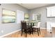 Cozy dining area adjacent to the kitchen, featuring stylish decor and ample natural light at 649 Ozburn Nw Rd, Atlanta, GA 30318