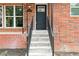 Close-up of the front door with stairs leading up, and a modern house number at 649 Ozburn Nw Rd, Atlanta, GA 30318