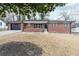 Charming brick home features a garage, well-maintained lawn, and inviting front entrance at 649 Ozburn Nw Rd, Atlanta, GA 30318