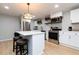 Modern kitchen with island, stainless steel appliances, and pendant lighting at 649 Ozburn Nw Rd, Atlanta, GA 30318