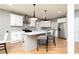 Elegant kitchen featuring a spacious island with pendant lighting, sleek appliances and stylish finishes at 649 Ozburn Nw Rd, Atlanta, GA 30318