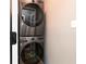 Modern stacked washer and dryer maximize space in this home's laundry area at 649 Ozburn Nw Rd, Atlanta, GA 30318
