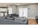 Living room featuring a gray couch, wood floors, and natural light at 649 Ozburn Nw Rd, Atlanta, GA 30318