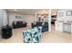 Open living area flowing into the kitchen, complete with stylish decor and ample seating at 649 Ozburn Nw Rd, Atlanta, GA 30318
