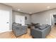 Spacious living room boasts wood floors, neutral tones, and comfortable seating at 649 Ozburn Nw Rd, Atlanta, GA 30318