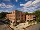 Aerial view of a modern brick building complex at 10625 Serenbe Ln # 103, Chattahoochee Hills, GA 30268