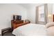 Bright bedroom with a comfortable bed and large window at 10625 Serenbe Ln # 103, Chattahoochee Hills, GA 30268