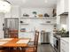 Bright kitchen, white shaker cabinets, stainless steel appliances at 10625 Serenbe Ln # 103, Chattahoochee Hills, GA 30268
