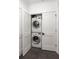 Convenient laundry closet with stacked washer and dryer at 10625 Serenbe Ln # 103, Chattahoochee Hills, GA 30268