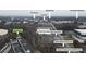 Aerial view of the community amenities, including a townhome, shopping, restaurants, and green spaces at 1412 Peter Haughton Nw Way, Atlanta, GA 30318