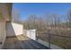 Wood deck with metal railings offering serene views of the surrounding trees and the property at 1412 Peter Haughton Nw Way, Atlanta, GA 30318