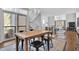 Dining room with modern chairs, light fixture, and open stairs to the second level at 1412 Peter Haughton Nw Way, Atlanta, GA 30318