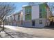 Contemporary townhome with a two-car garage and a vibrant green and white exterior at 1412 Peter Haughton Nw Way, Atlanta, GA 30318