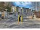 Gated entrance with security features and colorful townhomes, providing a safe and vibrant community at 1412 Peter Haughton Nw Way, Atlanta, GA 30318