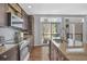 Modern kitchen featuring updated appliances, granite countertops, and plenty of natural light at 1412 Peter Haughton Nw Way, Atlanta, GA 30318