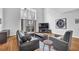Spacious living room featuring hardwood floors, comfortable seating, and abundant natural light at 1412 Peter Haughton Nw Way, Atlanta, GA 30318