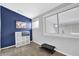 Office with dark blue accent wall, window, and carpet at 1412 Peter Haughton Nw Way, Atlanta, GA 30318
