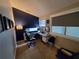 Office featuring dark blue accent wall, window, desk, and computer at 1412 Peter Haughton Nw Way, Atlanta, GA 30318