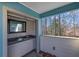 Covered outdoor wet bar area, perfect for entertaining with a sink and stylish accents at 1412 Peter Haughton Nw Way, Atlanta, GA 30318