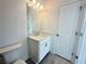 Clean bathroom with a white vanity, modern mirror, and tiled floors offering a functional space at 518 Healy Dr # 68, Cumming, GA 30040
