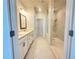 Bathroom features double vanity, marble floors, and a glass shower with marble surround at 518 Healy Dr # 68, Cumming, GA 30040