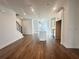 Open living space featuring hardwood flooring, recessed lighting, and a clear view of the modern kitchen at 518 Healy Dr # 68, Cumming, GA 30040