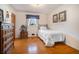 Well-lit bedroom with hardwood floors and built-in shelving at 3089 Ranlo Dr, Atlanta, GA 30340