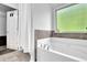 Relaxing bathroom with soaking tub and separate shower at 3945 Silverthorn Trce, Cumming, GA 30028