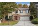 Two-story house with stone accents and a two-car garage at 3945 Silverthorn Trce, Cumming, GA 30028