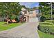 Two-story house with stone accents and a landscaped yard at 3945 Silverthorn Trce, Cumming, GA 30028