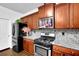 Updated kitchen with granite countertops and stainless steel appliances at 3945 Silverthorn Trce, Cumming, GA 30028
