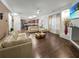 Open floor plan living area with hardwood floors and neutral decor at 3945 Silverthorn Trce, Cumming, GA 30028