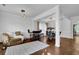 Open living space with hardwood floors and a cozy seating area at 3945 Silverthorn Trce, Cumming, GA 30028