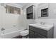 Updated bathroom with gray vanity and white tile at 4090 Tara Dr, Forest Park, GA 30297