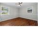 Well-lit bedroom, hardwood floors, and neutral wall paint at 4090 Tara Dr, Forest Park, GA 30297