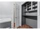 Shelved closet with gray walls and wood floor at 4090 Tara Dr, Forest Park, GA 30297