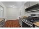 Modern kitchen with gray cabinets and stainless steel appliances at 4090 Tara Dr, Forest Park, GA 30297