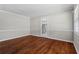 Bright living room with hardwood floors and French doors at 4090 Tara Dr, Forest Park, GA 30297